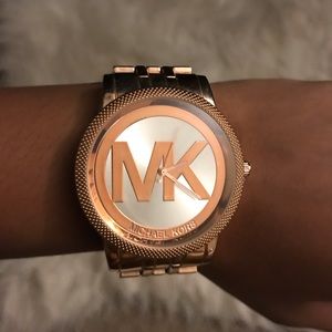 I’m selling a rose gold Michael Kors wrist watch.